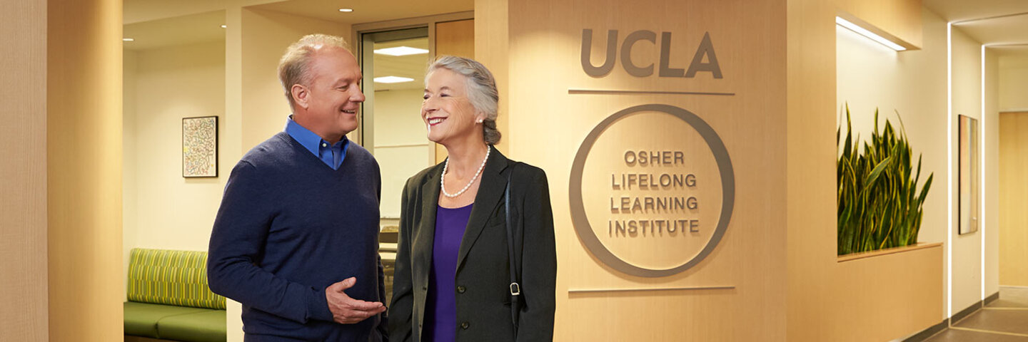 Mature students over 50 talking inside the Gayley Building